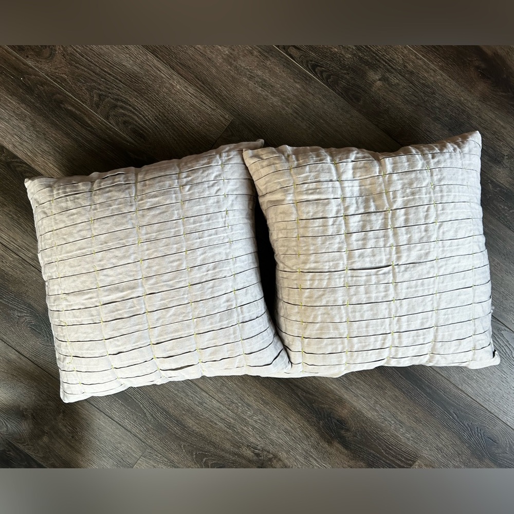 Grey pleated accent pillows